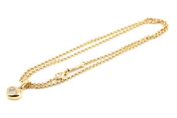 Vorschaubild: Halskette mit goldenem Anhänger in Herzform und Strassstein.